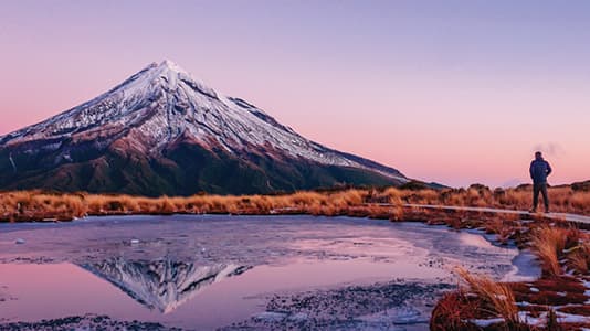 A photo of Mt Cook in front of a purple sunset. Mt Cook is located in New Plymouth.